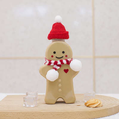Bouteilles en plastique de jus de Noël avec le chapeau de preuve de fuite, bouteilles vides de thé de lait