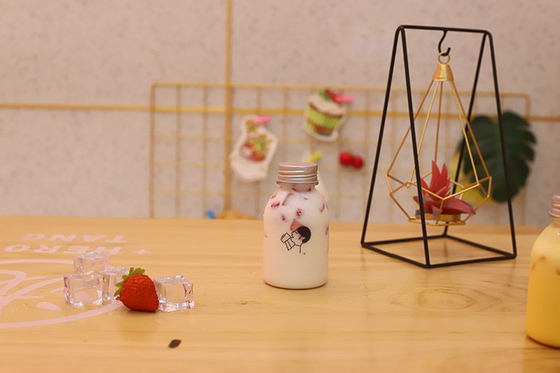 Bouteilles de thé au lait en plastique avec poignée pour une consommation efficace et efficace