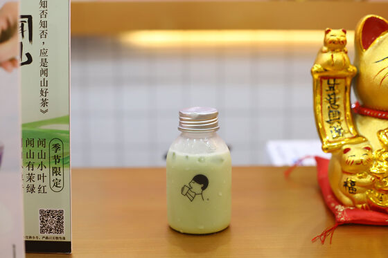 Bouteilles de thé au lait à enroulement à couvercle moyen caractéristique étanche garantissant la commodité et la sécurité dans la manipulation des boissons