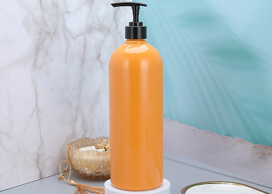 le distributeur en plastique de pompe de shampooing orange de 25mm met 900ml en bouteille